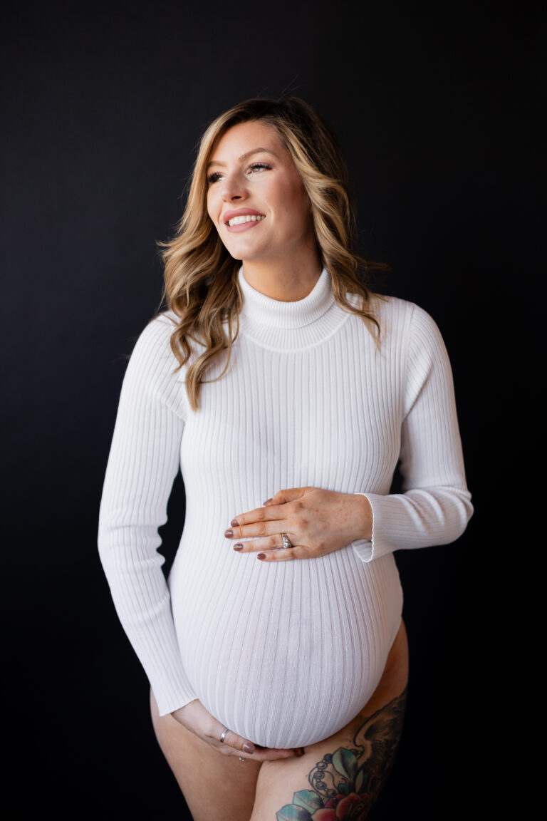 Pregnant woman poses for studio maternity session in Seattle