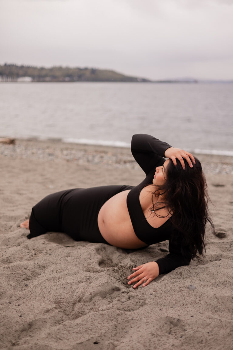 Pregnant woman on Golden Gardens beach Seattle, WA for maternity photography session