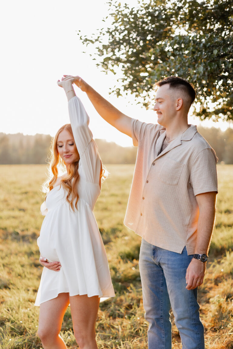 Couples maternity photoshoot in North Bend, WA couple dancing